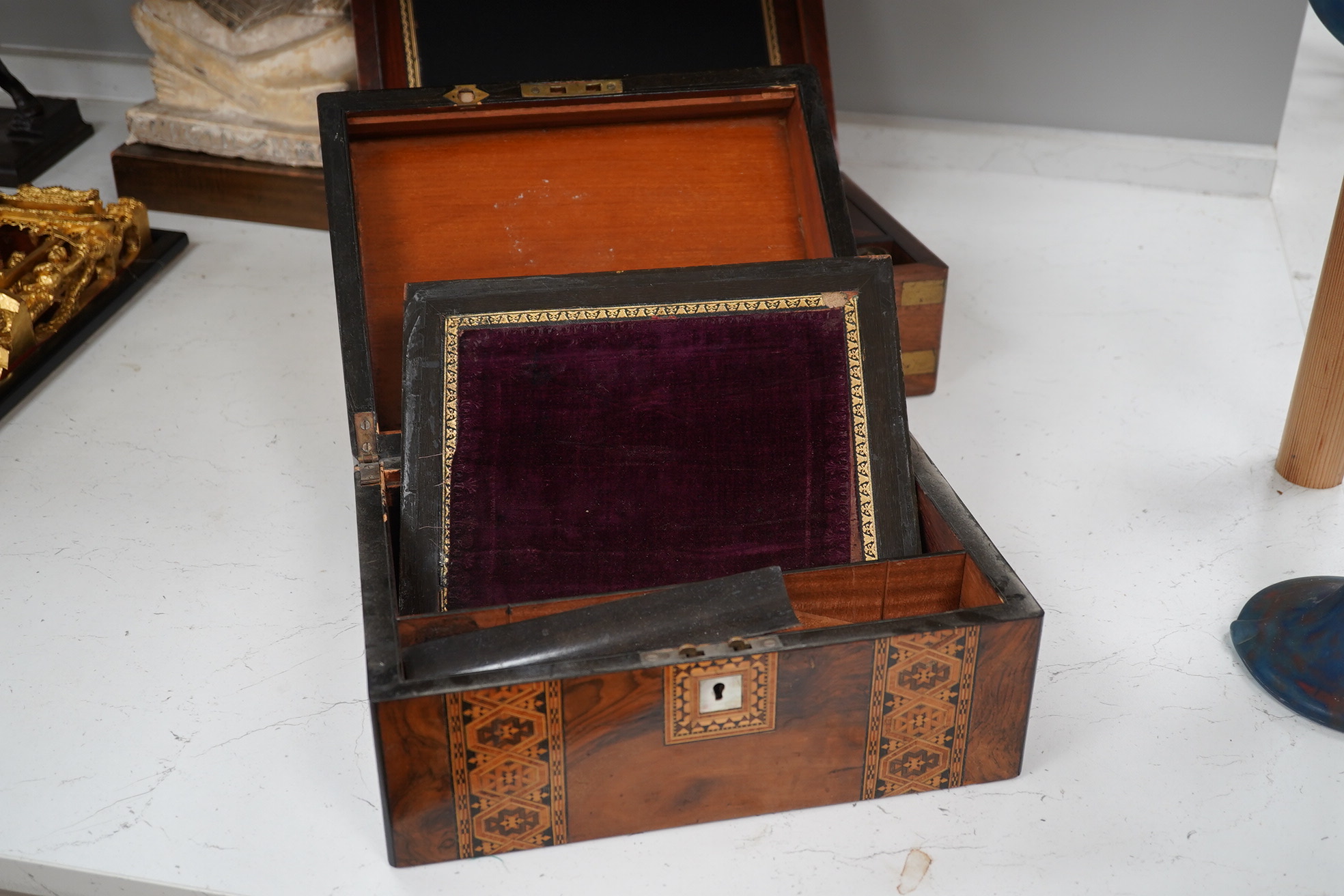 A mahogany brass mounted 19th century writing box and a walnut inlaid and mother of pearl writing box, brass mounted box, 35cm wide. Condition - exterior good, felt on slope torn.